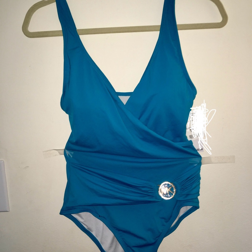 NWT Michael Kors Teal Swimsuit. Size 8. V-neck drop. Neck tie. Pads in top.